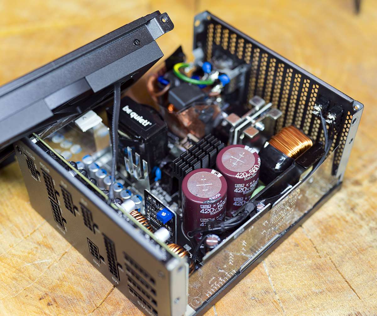 BQ Dark Power 14 1000W internals, on a wooden table, PSU, power supply unit