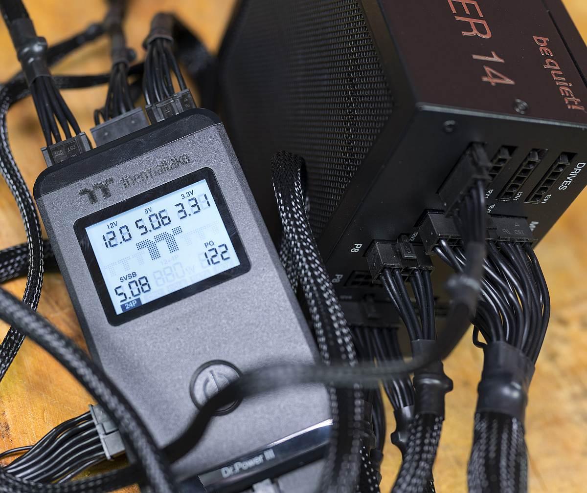 BQ Dark Power 14 1000W measurement, power tester, Dr Power III, on a wooden table, PSU, power supply unit