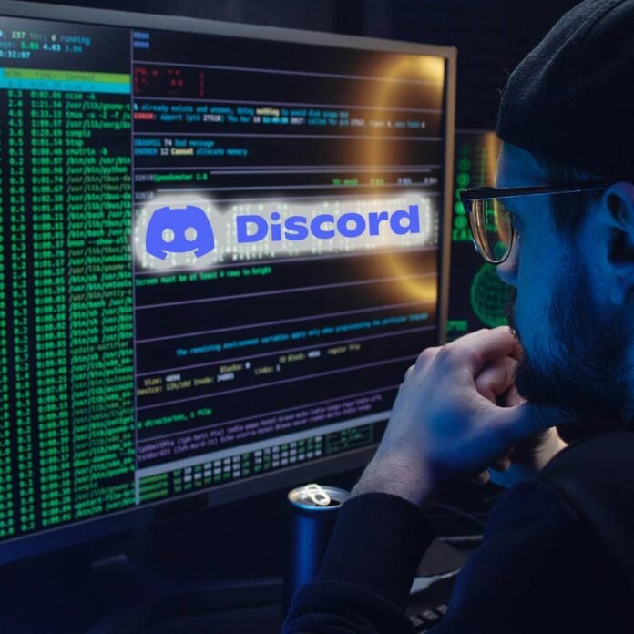 Hacker looking at a screen that says 'Discord'.