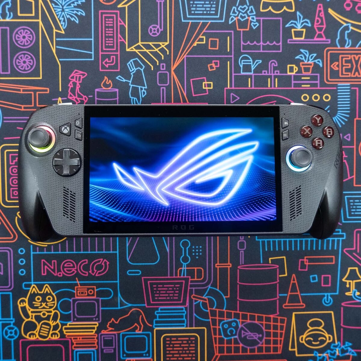 A top-down view of ROG Xbox Ally X against a neon-style backdrop.