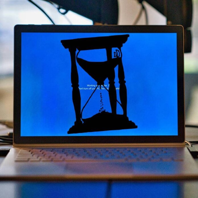 Windows 10 laptop with hourglass silhouette