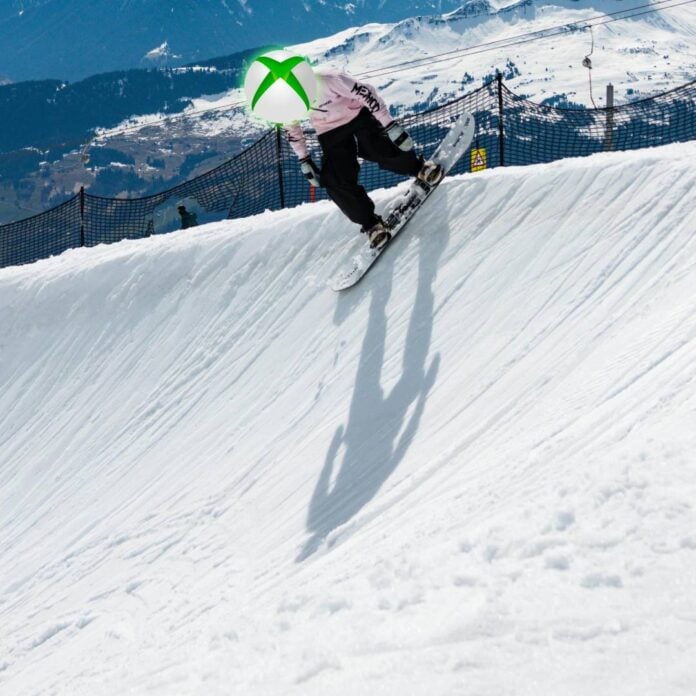 Snowboarder with Xbox logo for a head stares down a slippery ski slope