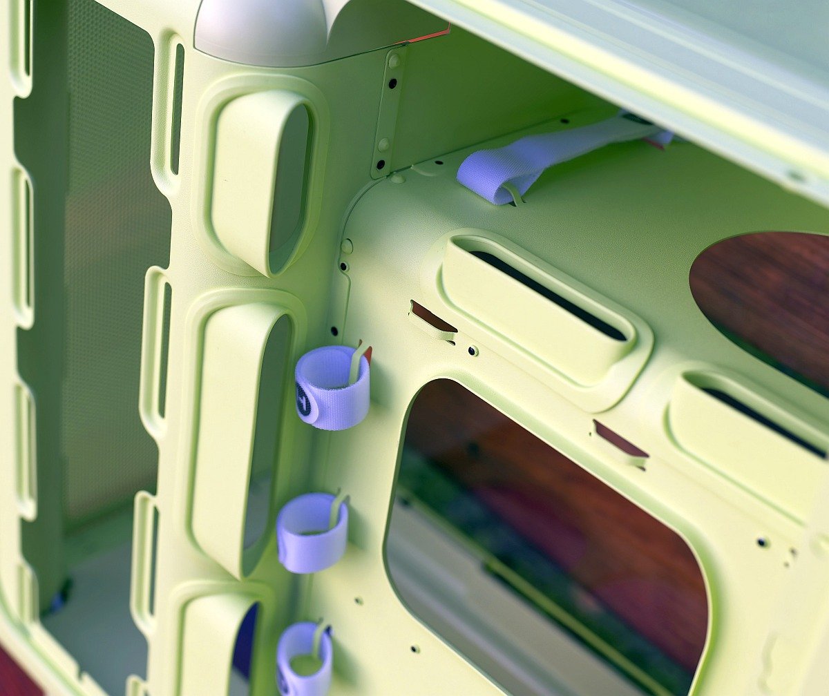 Hyte X50 back side, rubber grommets