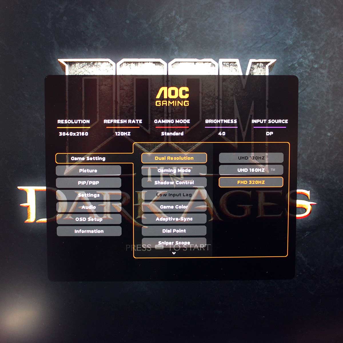 AOC Gaming U27G4R dual-mode gaming monitor running Doom The Dark Ages with dual-mode menu showing on OSD