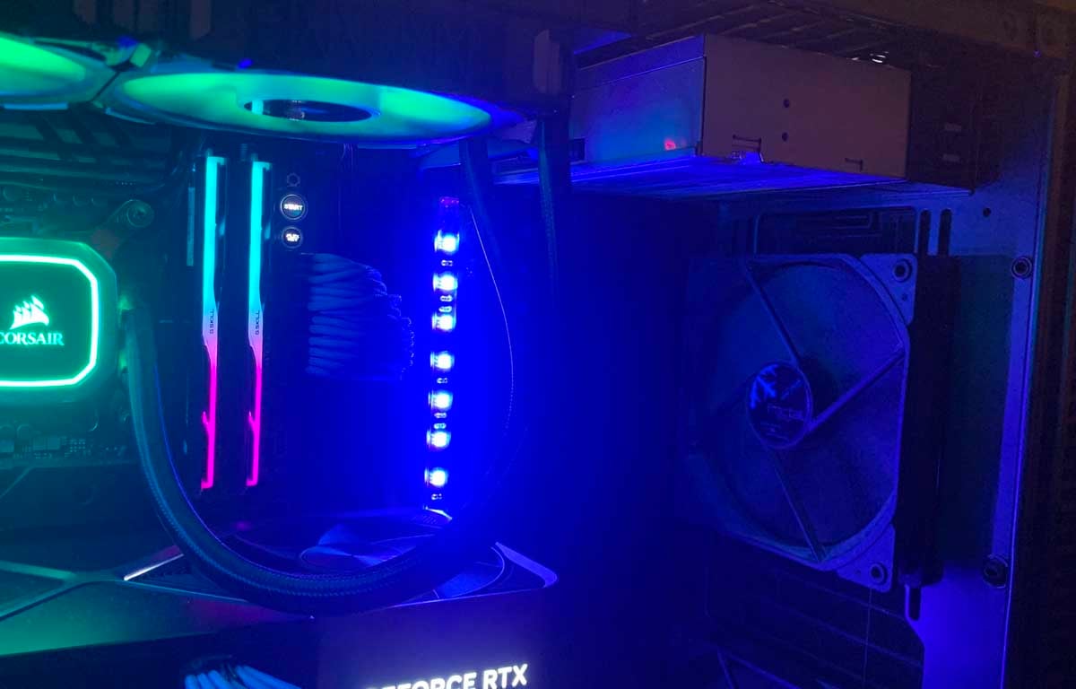 Bring back 5.25in drive bays: Optical drive installed inside an RGB gaming PC.