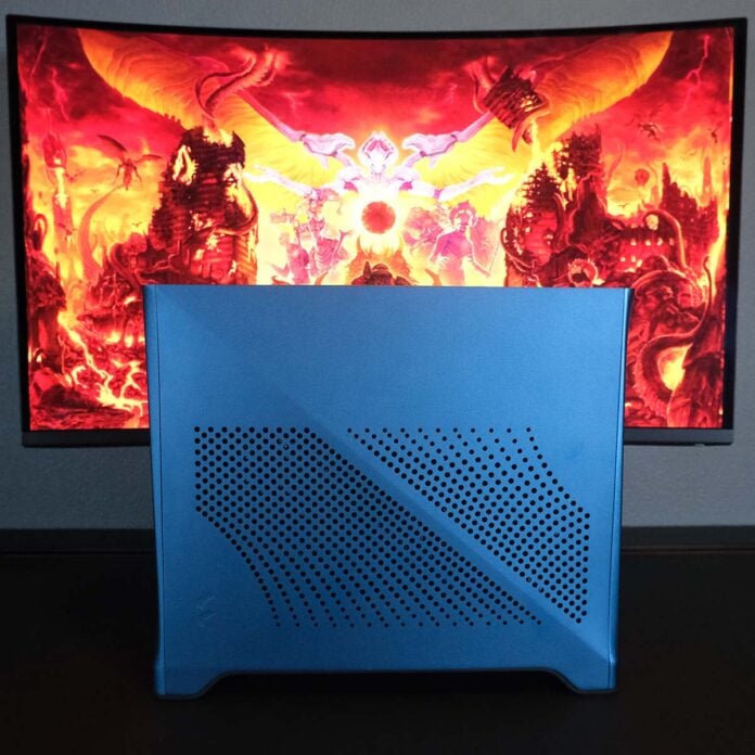 Fractal Design Era 2 system, sat in front of a Doom Eternal background on a monitor.