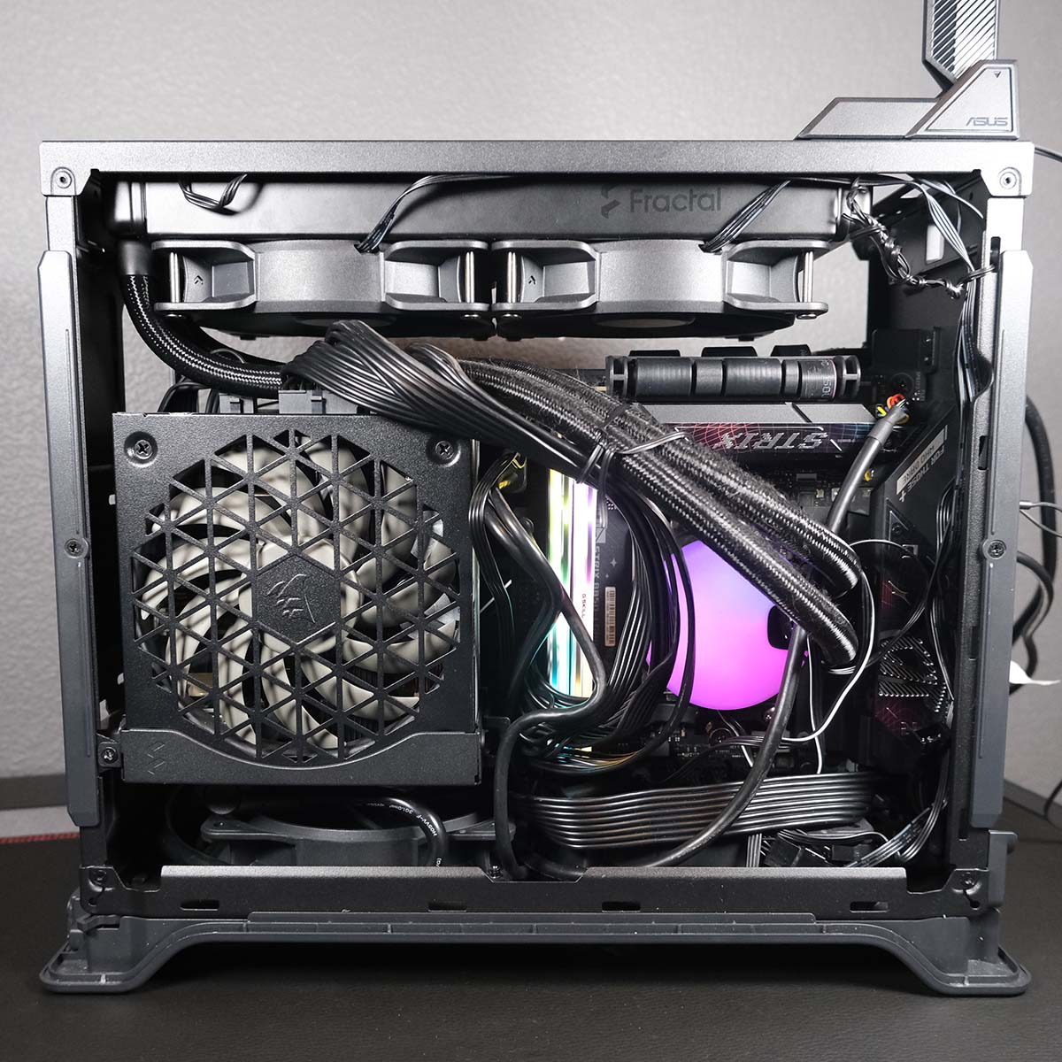 Fractal Design Era 2, populated with components, wires tidied with cable ties, powered on.