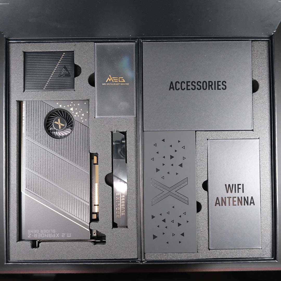 A top-down view of all the boxes inside the MSI MEG X870E Godlike X retail packaging.