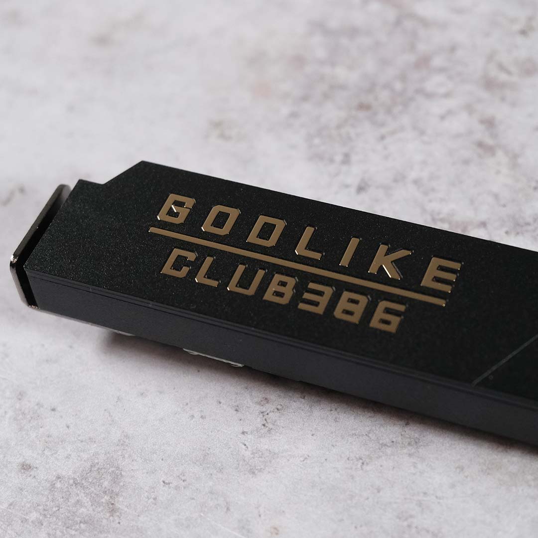 A close-up of the custom 'Godlike - Club386' M.2 heatsink that came inside our MSI MEG X870E Godlike X review sample.