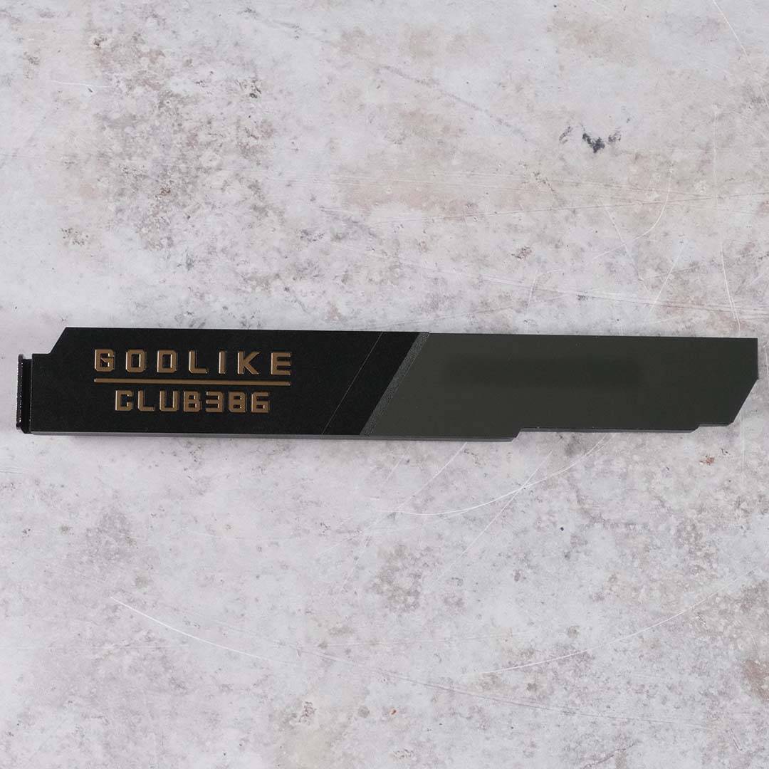 A wide shot of the custom 'Godlike - Club386' M.2 heatsink that came inside our MSI MEG X870E Godlike X review sample.