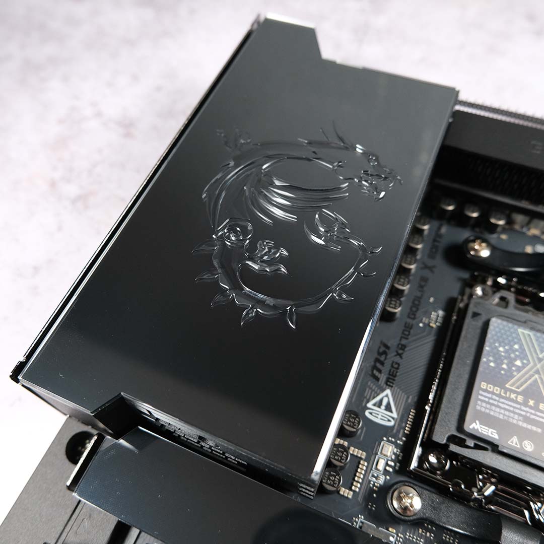 A close-up of the stereoscopic dragon engraving on MSI MEG X870E Godlike X.