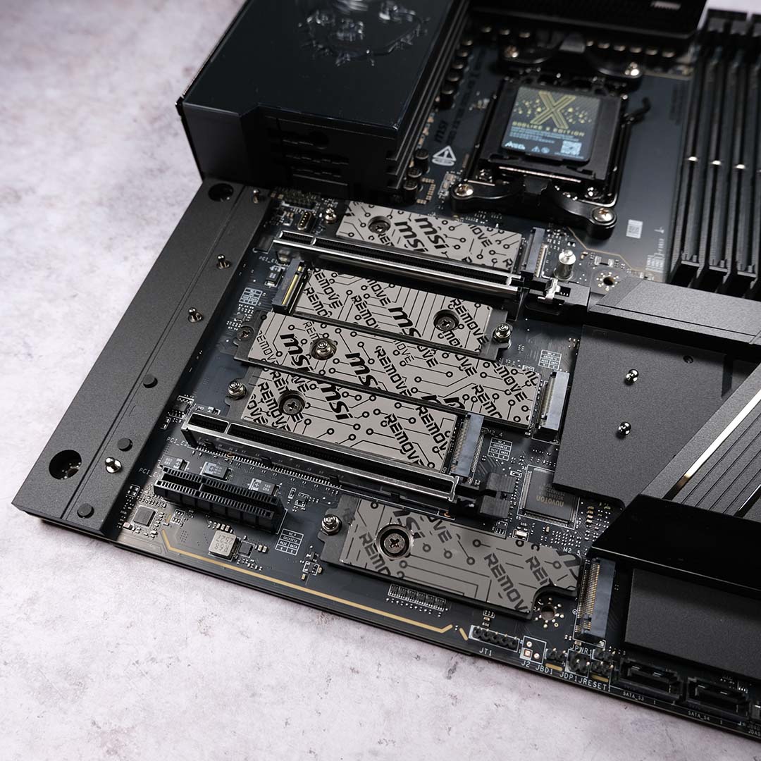 A top-down view of the PCIe and M.2 expansion slots on the MSI MEG X870E Godlike X motherboard.