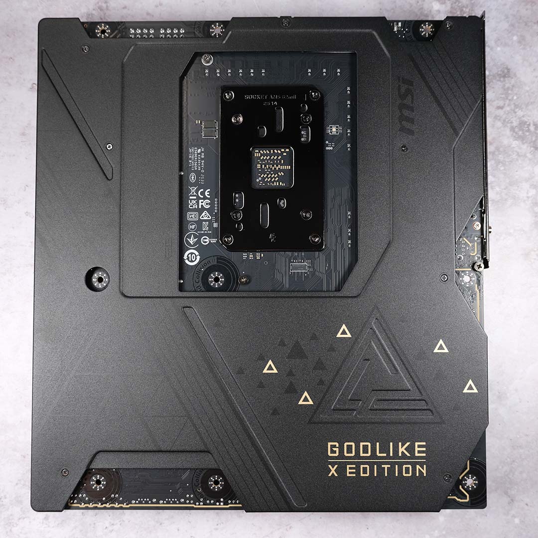 A top-down view of the backplate installed on the MSI MEG X870E Godlike X motherboard.