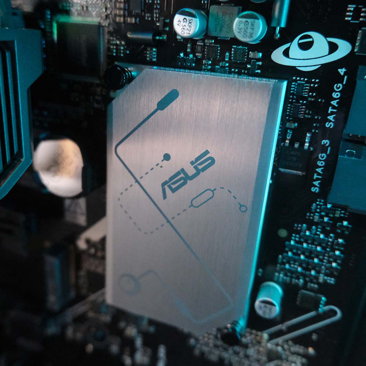 A close-up of the chipse heatsink on the Asus Prime B850-Plus WiFi motherboard inside the PCSpecialist Aegis Pro R gaming PC.