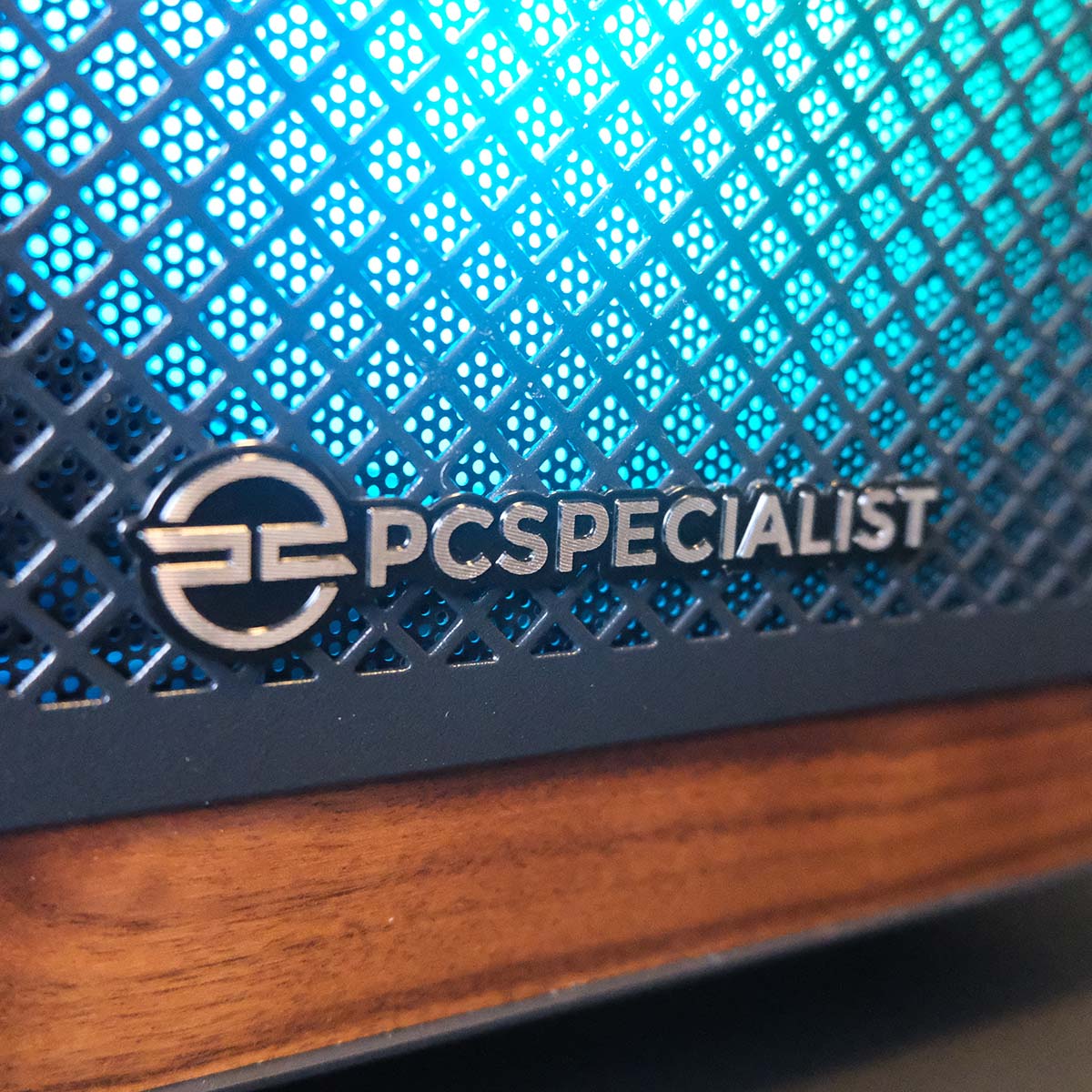 A close-up of the PCSpecialist logo on the Aegis Pro R gaming PC.