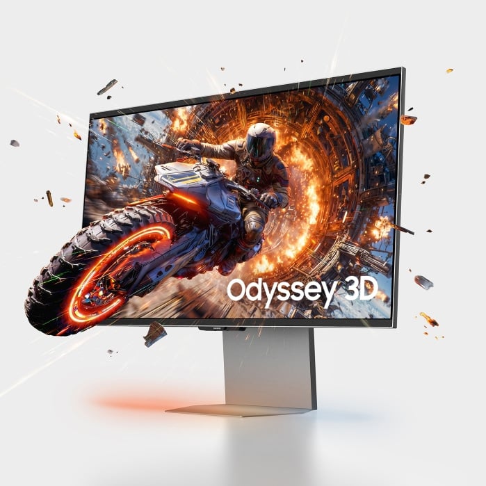 Key art for the Odyssey 3D gaming monitor, from which a motorcyclist is coming out of the screen.