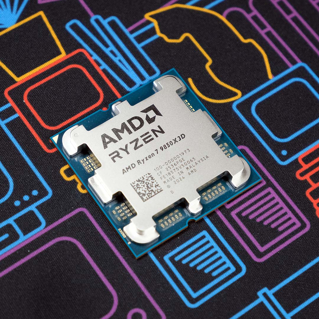 An AMD Ryzen 7 9850X3D processor, on top of a neon backdrop.