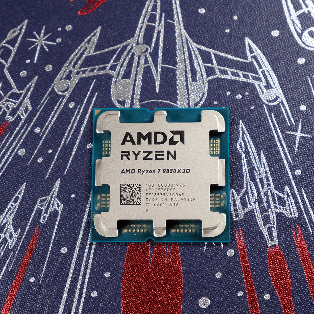 An AMD Ryzen 7 9850X3D processor, atop a background of rocket ships.
