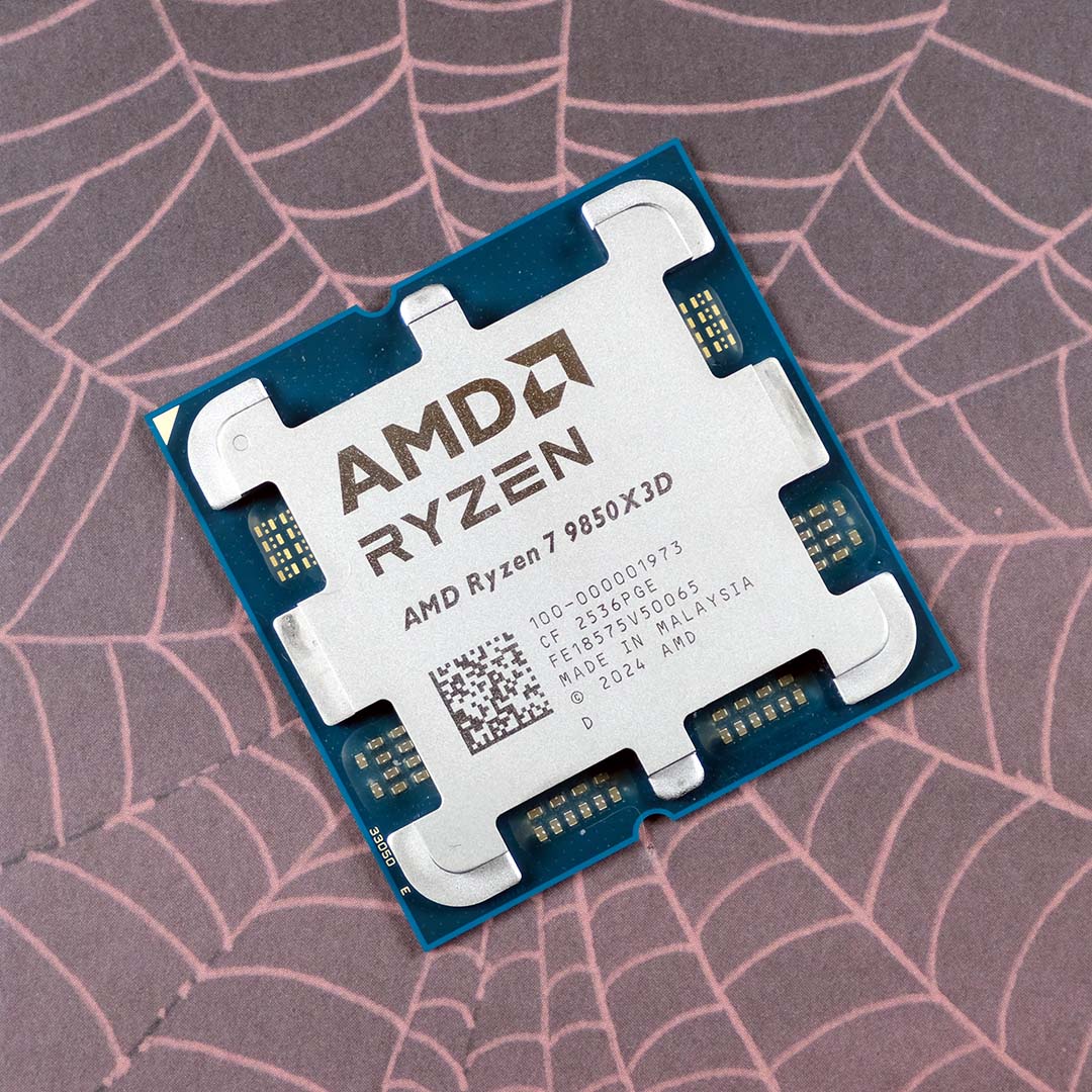 An AMD Ryzen 7 9850X3D processor, atop a pink spider web.