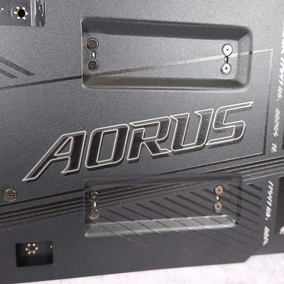 A close-up of the Aorus logo on the Gigabyte X870E Aorus Xtreme X3D AI TOP's backplate.