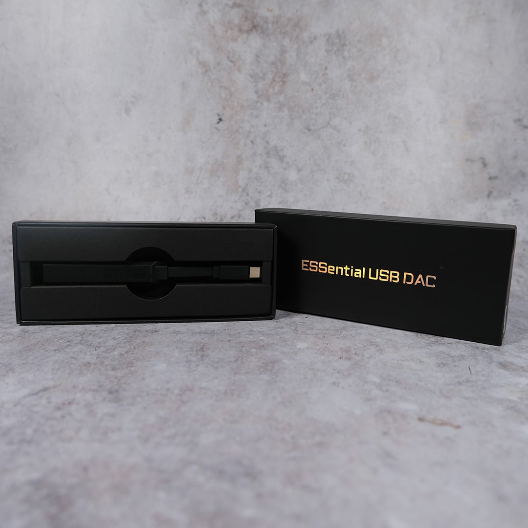 A wide shot of the USB DAC in its packaging, as bundled with the Gigabyte X870E Aorus Xtreme X3D AI TOP.