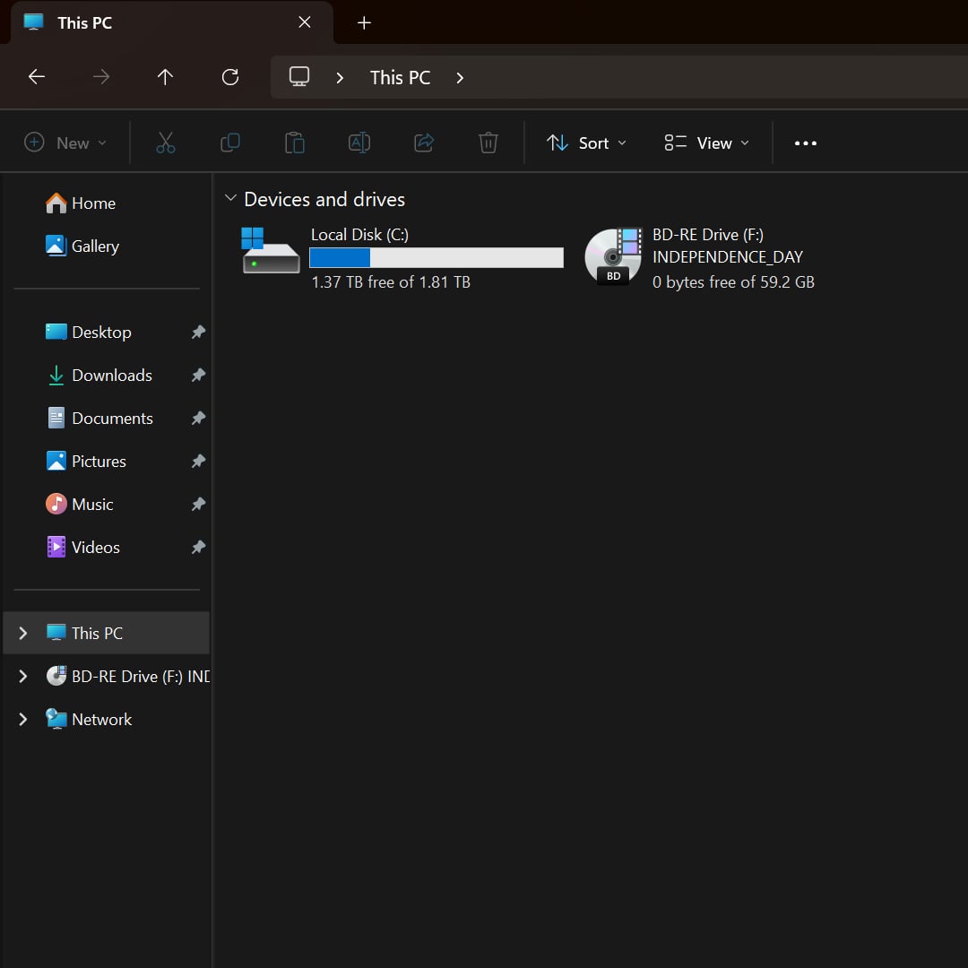 A screenshot of Windows 11 File Explorer, listing a primary drive and a disc drive.