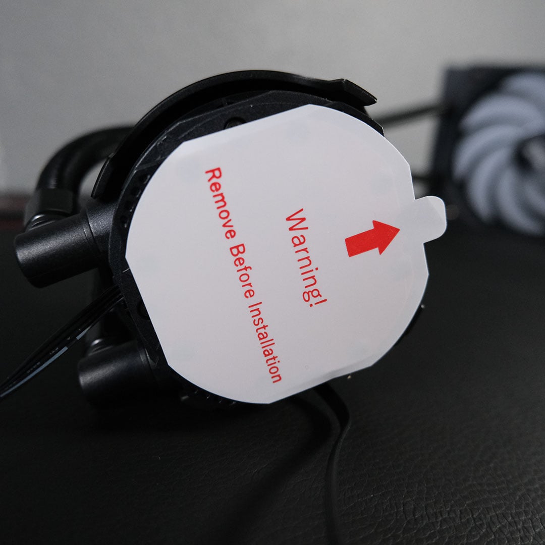 A close-up of the warning sticker attached to the Levelplay Combat Liquid 360 HUD's coldplate.