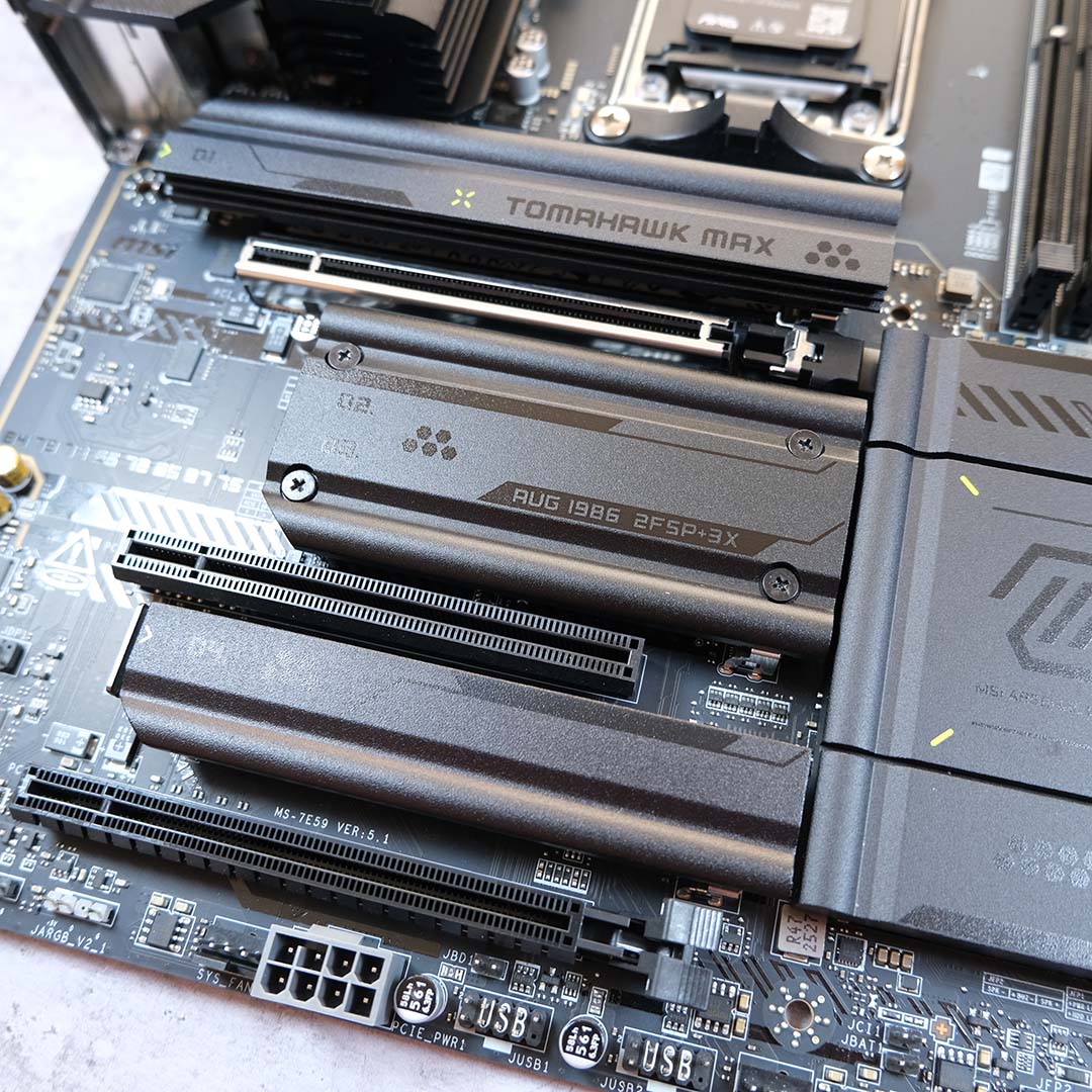 A side-on view of the motherboard's expansion slots, their covers present.