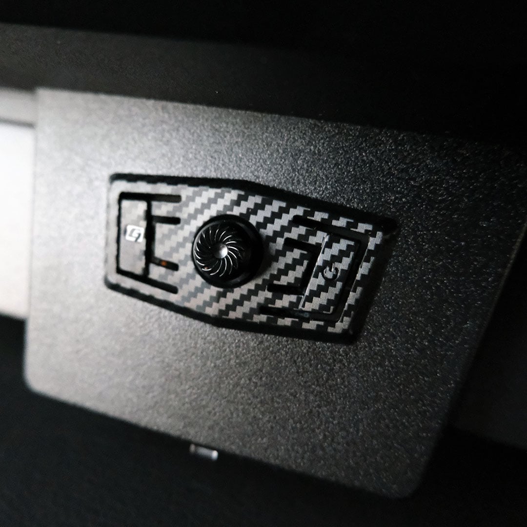 A close-up of the joystick on the rear of the MSI MPG 341CQR QD-OLED X36.