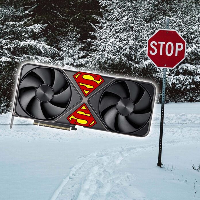 An Nvidia GeForce RTX 50 Founders Edition card with Superman logos on its frontplate, standing next to a stop sign on a snow-covered road.