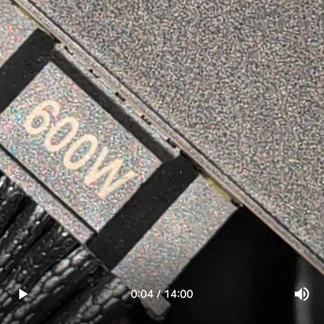 MSI yellow-coded 12V-2x6 power connector backing out from an Nvidia RTX card.