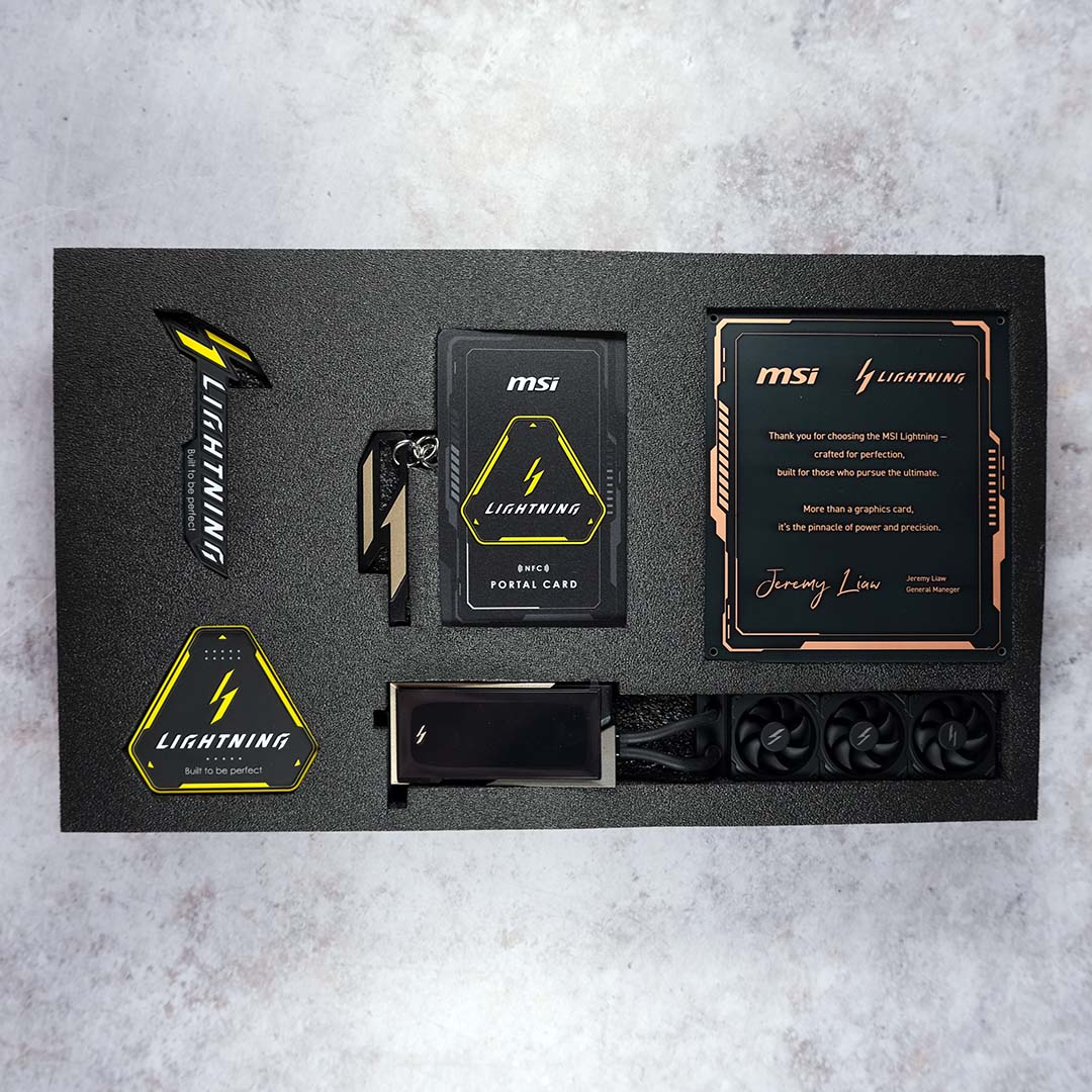 A top-down view of all the accessories that come with the Lightning Z, inside their packaging.