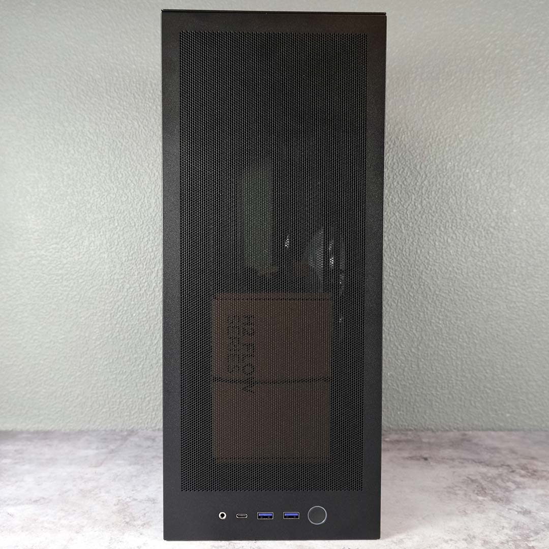 A front view of the NZXT H2 Flow, panel on, accessories inside.