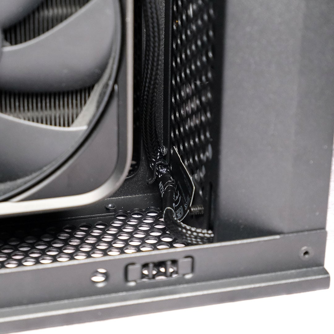 A close-up of the top fan cable management in the NZXT H2 Flow.