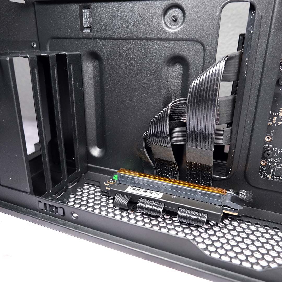 A wide shot of the GPU brackets and PCIe riser in the NZXT H2 Flow.