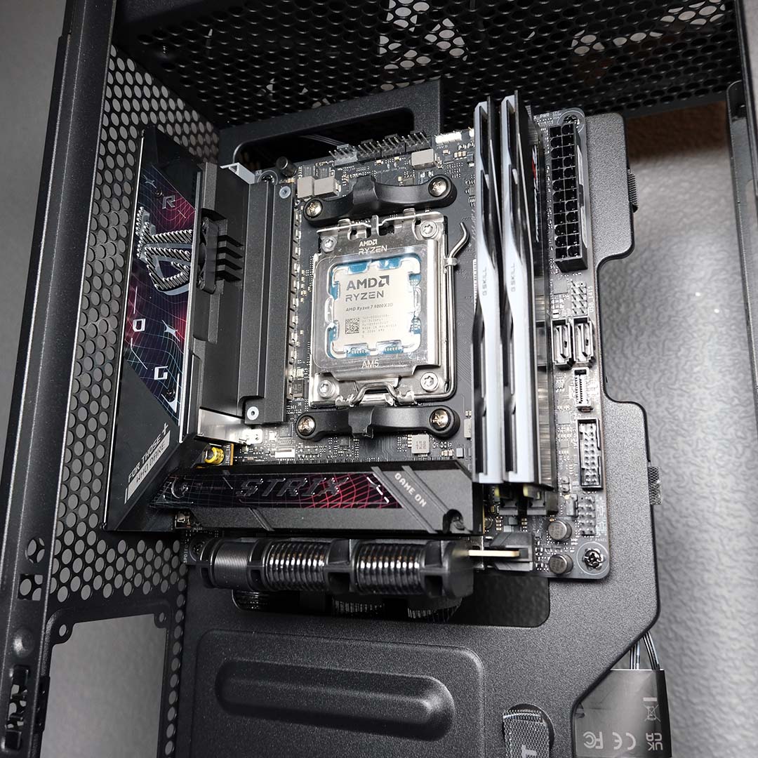 A wide shot of a motherboard and other components installed in the NZXT H2 Flow.