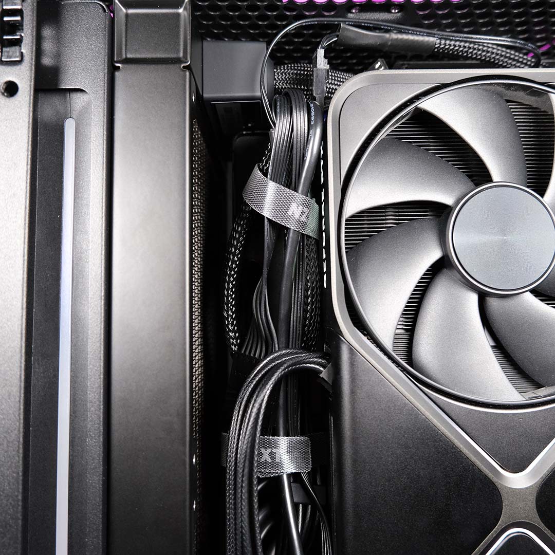 A wide shot of NZXT cable ties, keeping wires in check inside the NZXT H2 Flow.