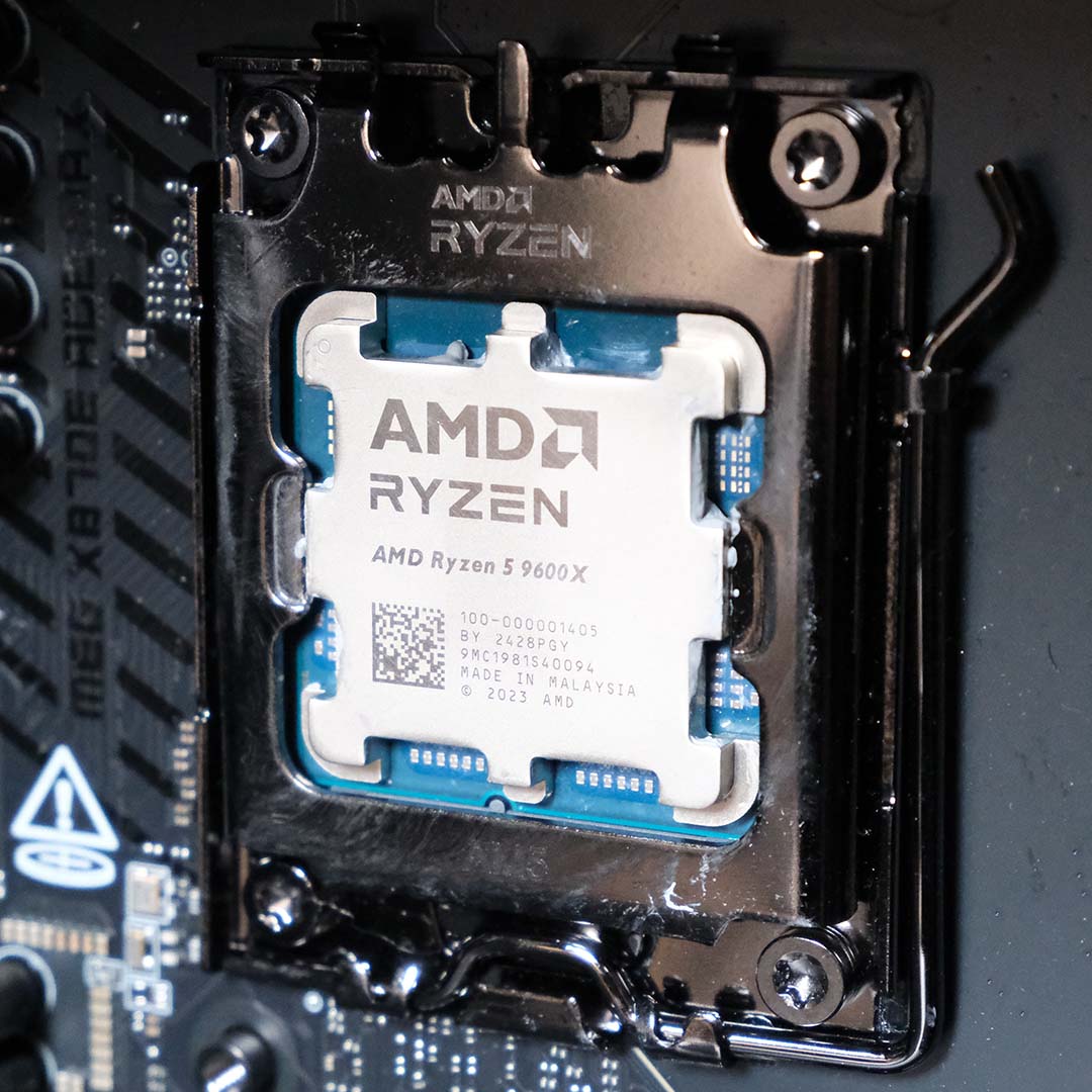 An AMD Ryzen 5 9600X processor in an AM5 CPU socket.