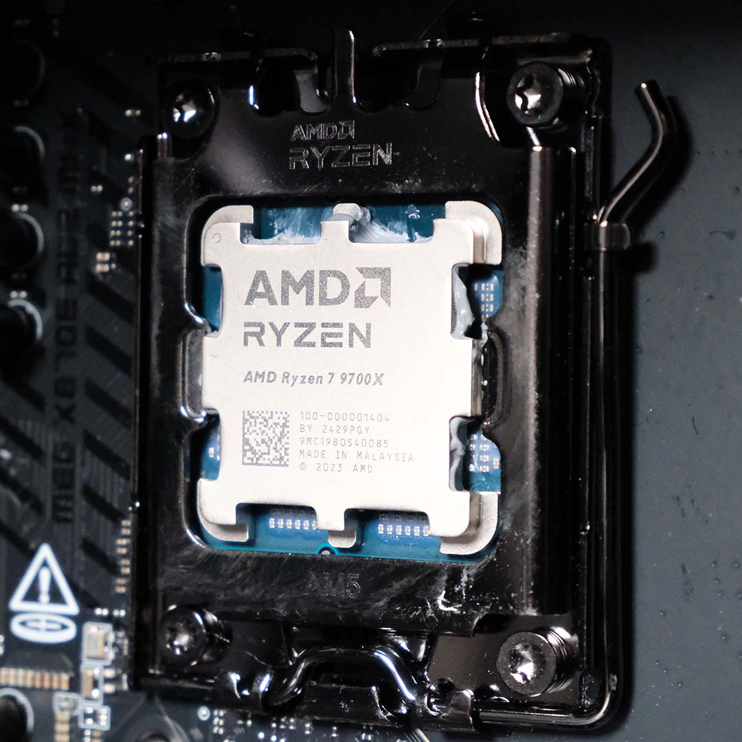 An AMD Ryzen 7 9700X processor in an AM5 socket.