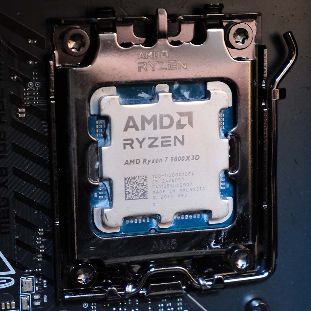 An AMD Ryzen 7 9800X3D processor in an AM5 CPU socket.