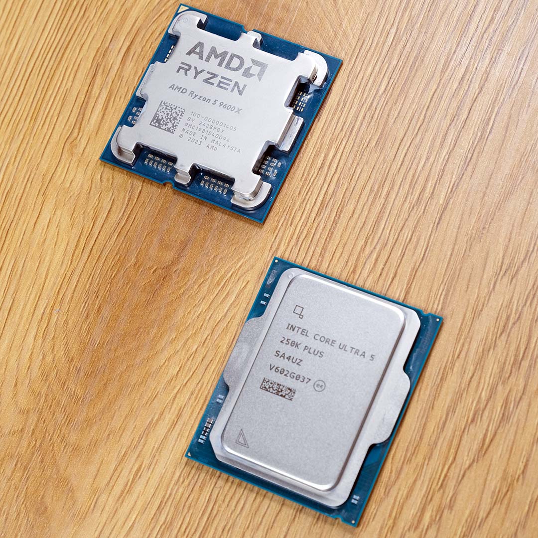 An Intel Core Ultra 5 250K Plus (left) and AMD Ryzen 5 9600X (right) atop a wooden backdrop.