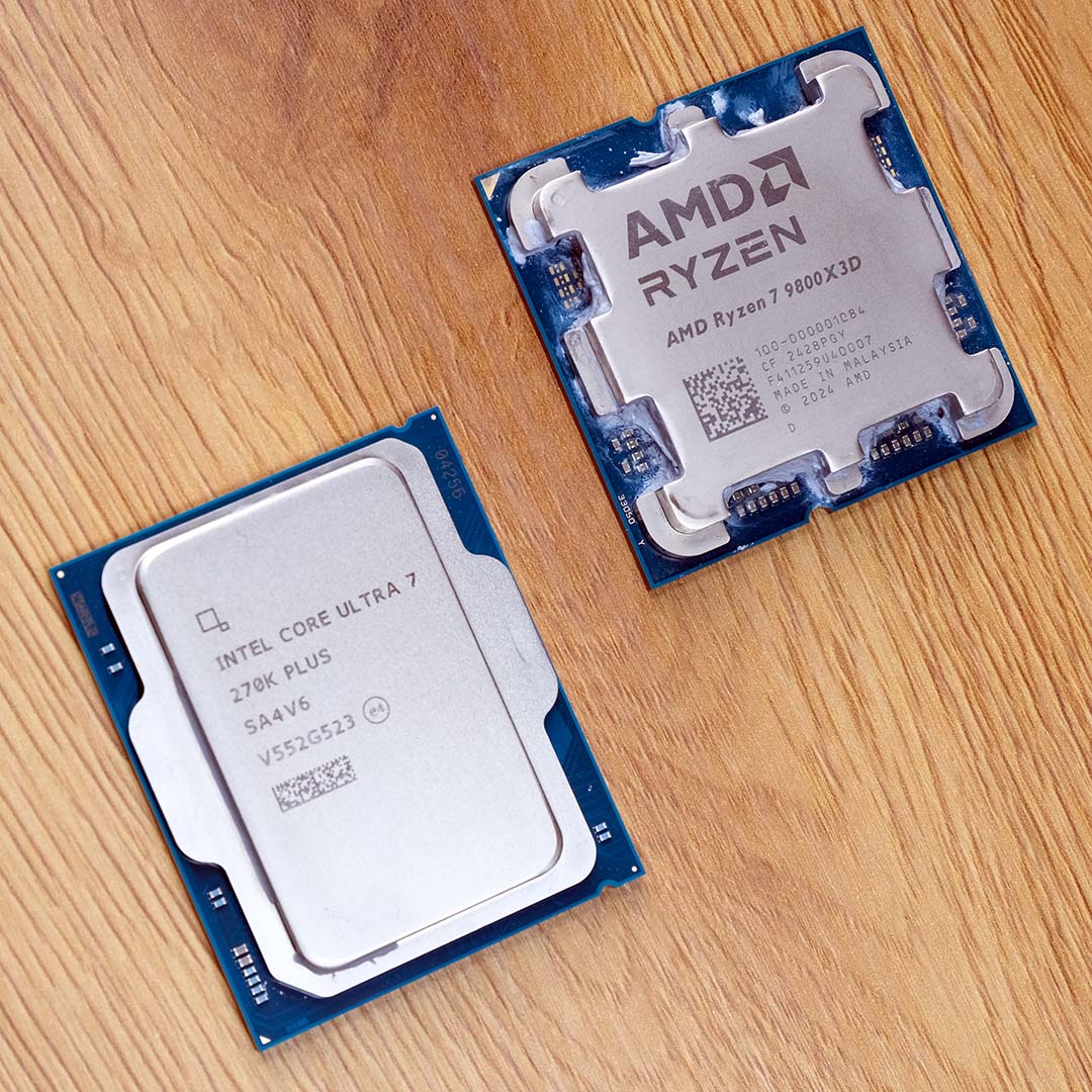 An Intel Core Ultra 7 270K Plus processor (bottom left) and Ryzen 7 9800X3D (top right) on top of a wooden surface.