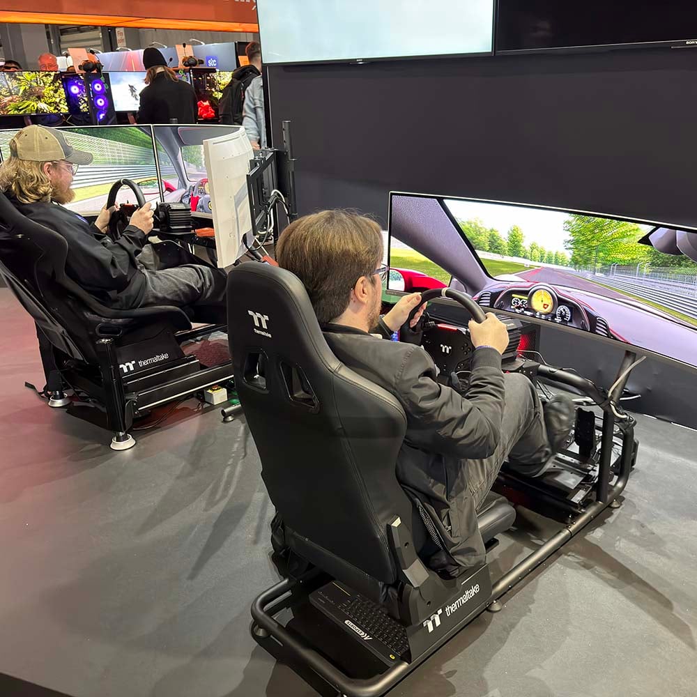 DreamHack 2026 sim racing in Thermaltake gaming chairs