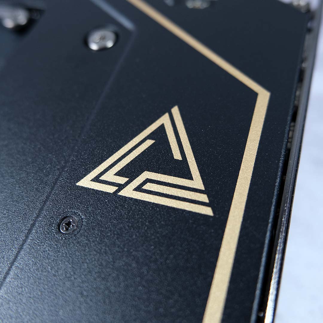 A close-up of the MEG logo on the MSI MEG X870E Ace Max motherboard's backplate.