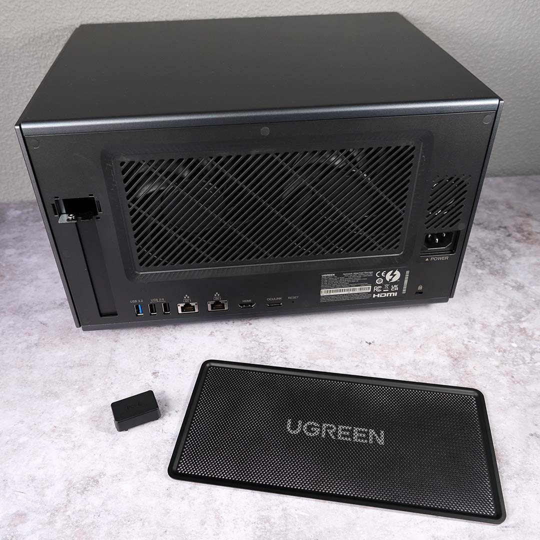 The rear of the Ugreen NASync iDX6011 Pro, the system's magnetic dust filter and PCIe cover removed.