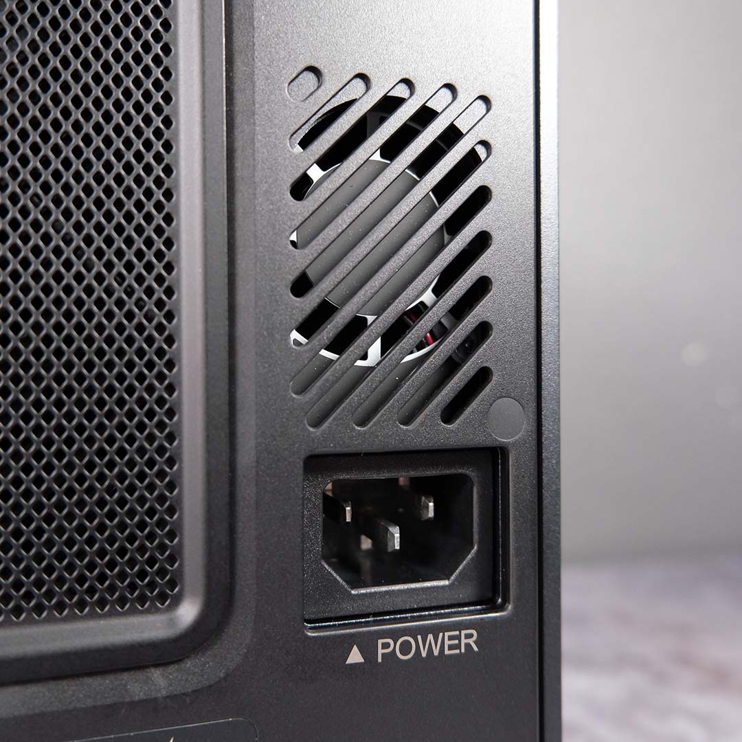 A close-up of the Ugreen NASync iDX6011 Pro's power supply fan and outlet.