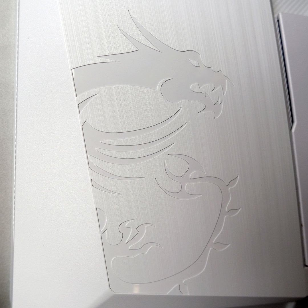 A close-up of the dragon logo on the MSI MAG 272QPW QD-OLED X28.