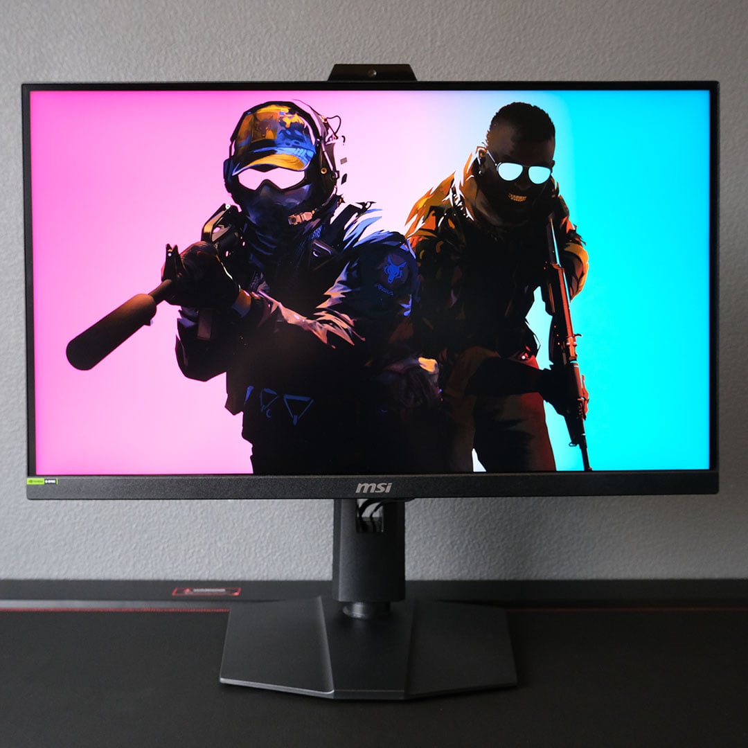 Counter-Strike 2 key art, with a pink-blue hue, displaying on the MSI MPG 272QRF X36 monitor.