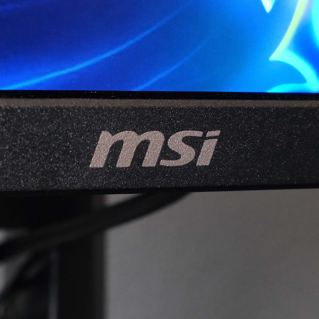 A close-up of the MSI logo on the MPG 272QRF X36 monitor.