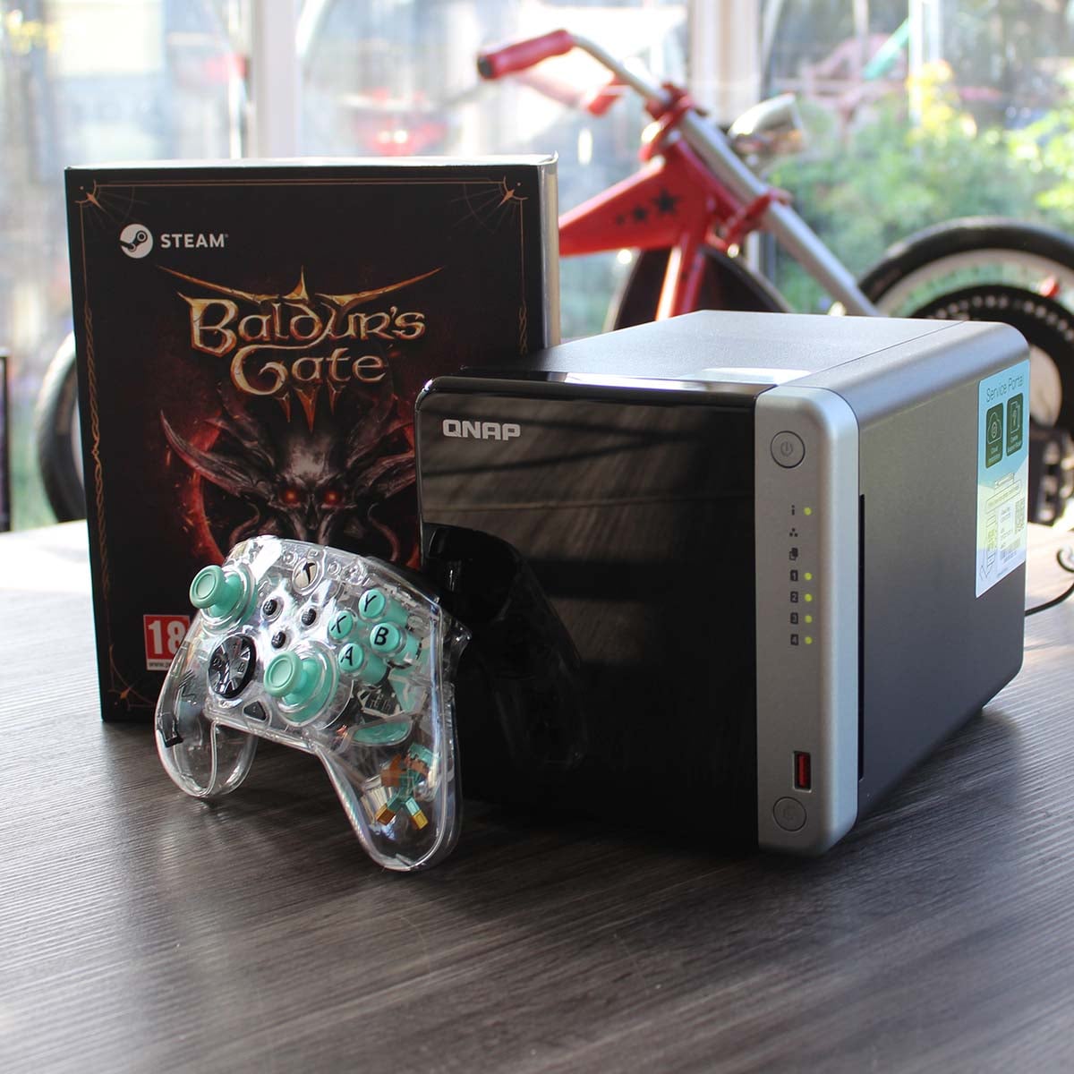 QNAP NAS with gamepad and Baldur's Gate 3 box